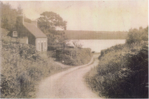 Undated photograph of Port Lion showing one cottage and the River Cleddau in the background. After World War 2 Vern Morgan, his sister, mother Peggy and father Willie John lived here after being bombed out in Portsmouth. After many years Peggy's sister Minnie lived here with her husband